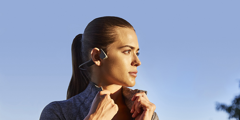 woman-running-with-garmin-watch-listening-music
