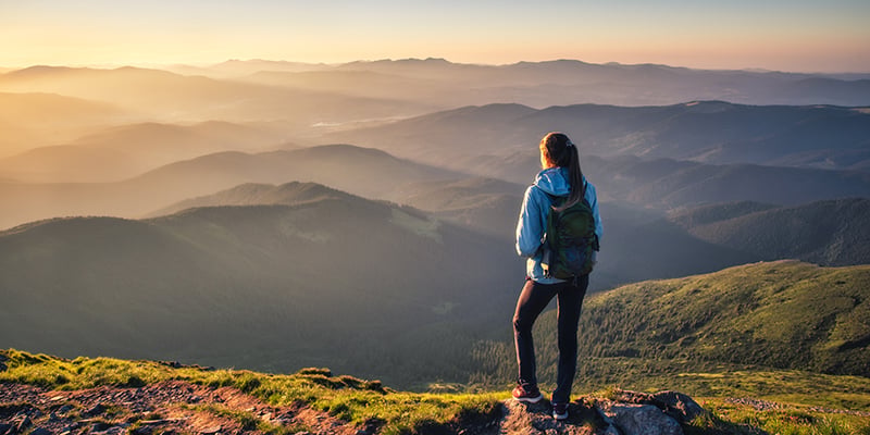 woman-loves-mountain-standing-with-sunshine
